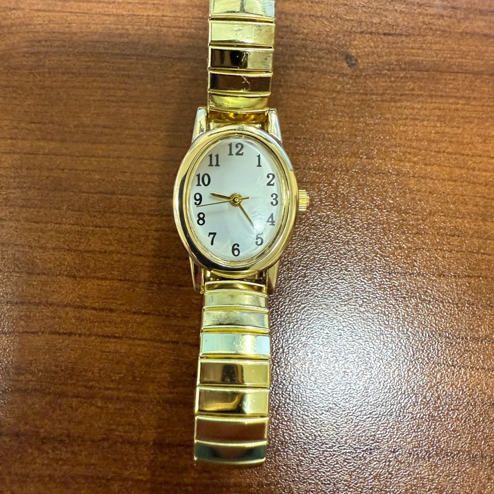Elegant Gold Watch with White Dial
